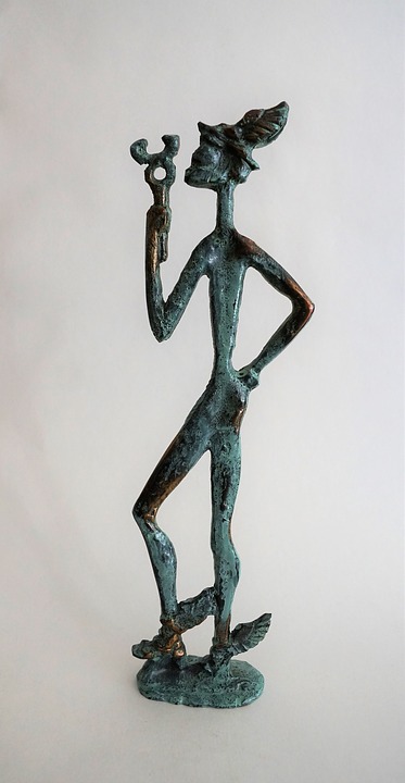 a metal sculpture of the messenger god hermes, standing with his staff